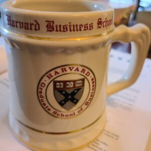 A ceramic mug with Harvard Business School logo and text.